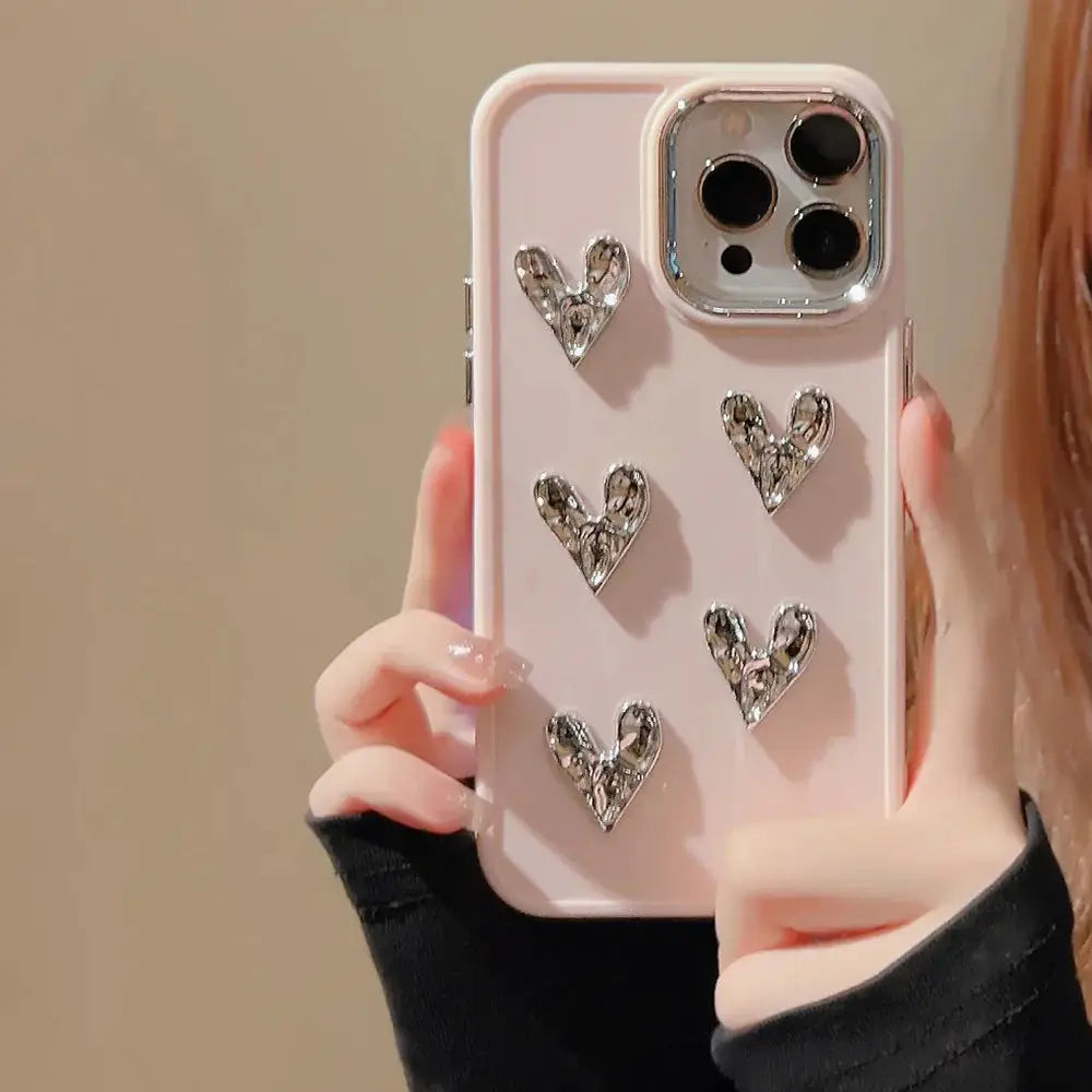 Pink pleated metallic heart charm phone case back view with five sparkling silver heart-shaped embellishments