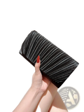 Black pleated satin clutch with a sleek textured surface and subtle sheen minimalist women’s evening bag