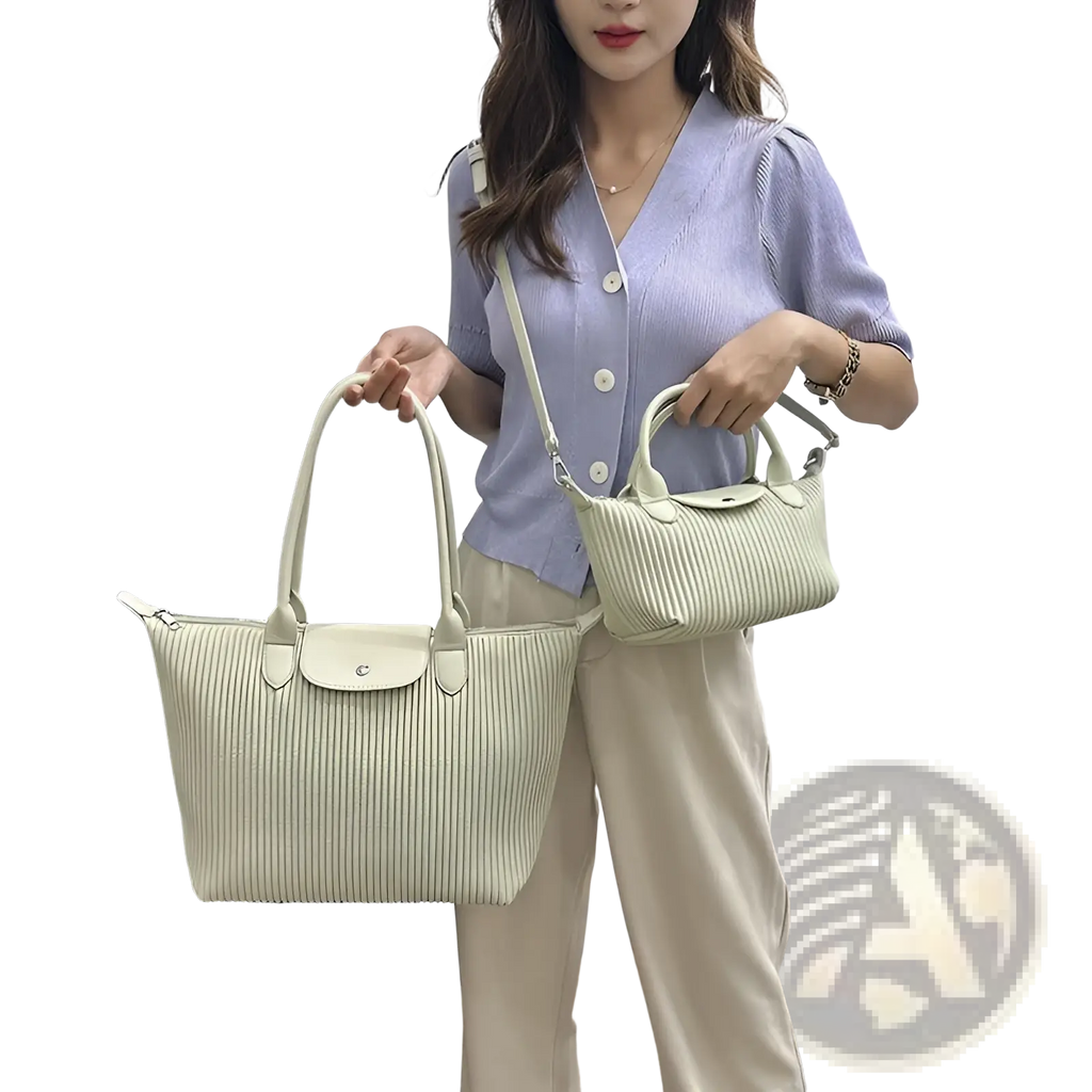 A pair of light green pleated shoulder bags in ribbed pu leather with matching handles and flap closure