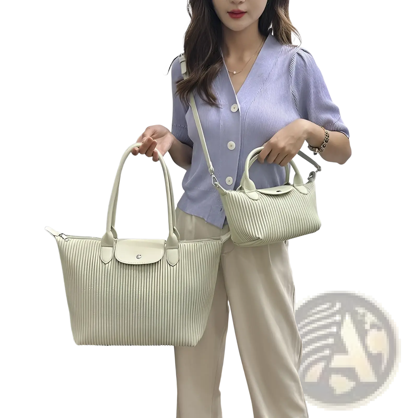 A pair of light green pleated shoulder bags in ribbed pu leather with matching handles and flap closure