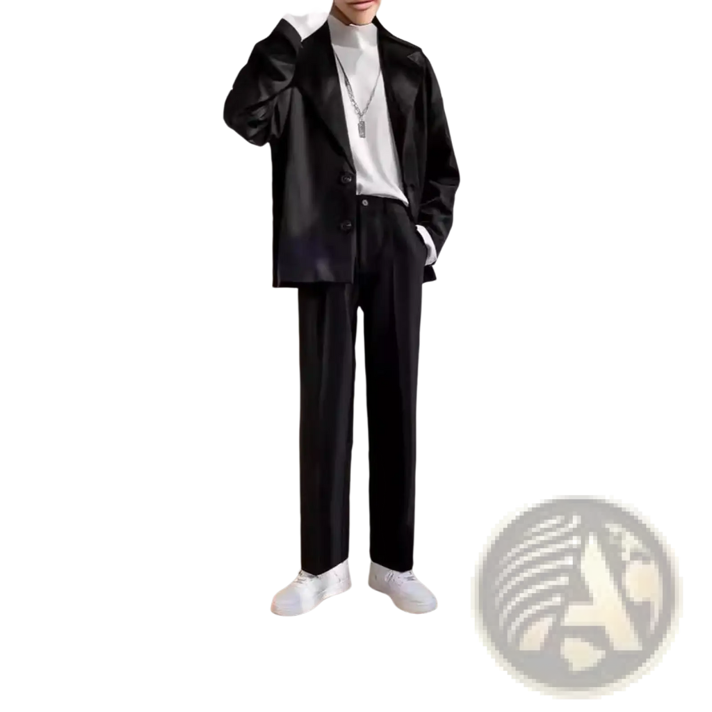 Black satin blazer with sleek modern cut and subtle sheen paired with pleated straight leg draping loose pants