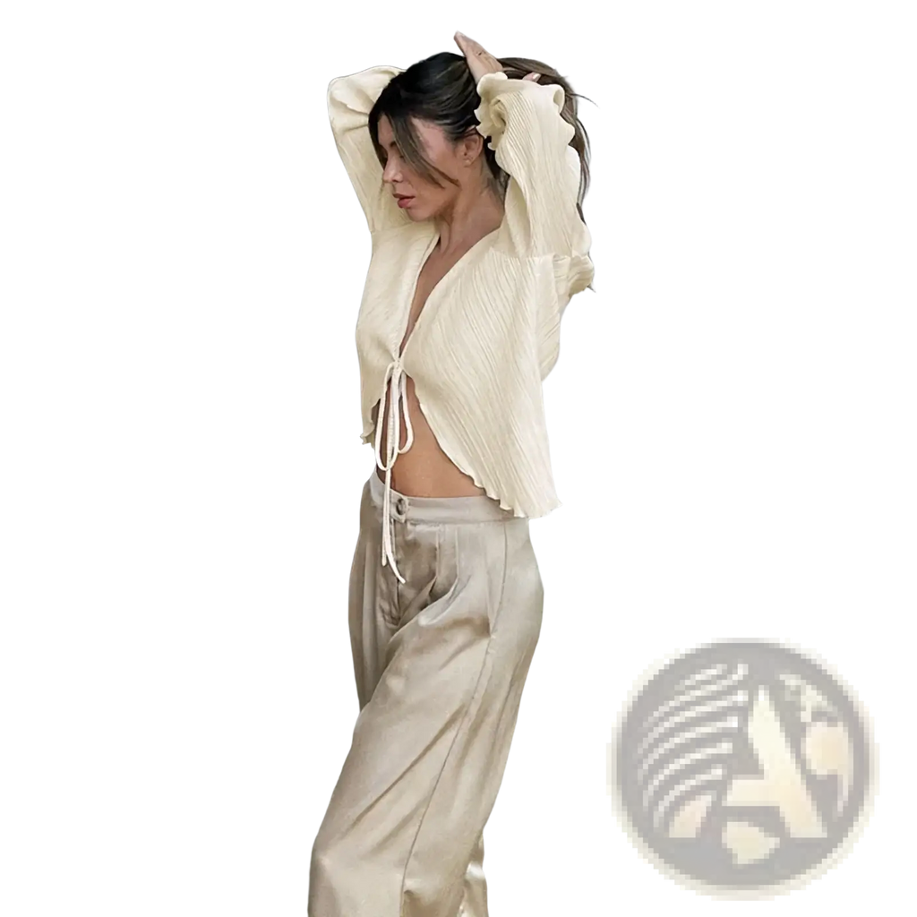 A cream-colored ribbed knit cropped top with a tie-front detail in a pleated v neck tie cardigan blouse style