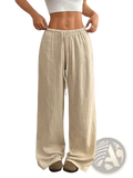 Beige pleated wide leg casual pants with textured crinkled fabric and elastic waistband for comfortable wear