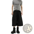 Black pleated wide-leg mens suit shorts with high waist worn with a gray ribbed short-sleeve top