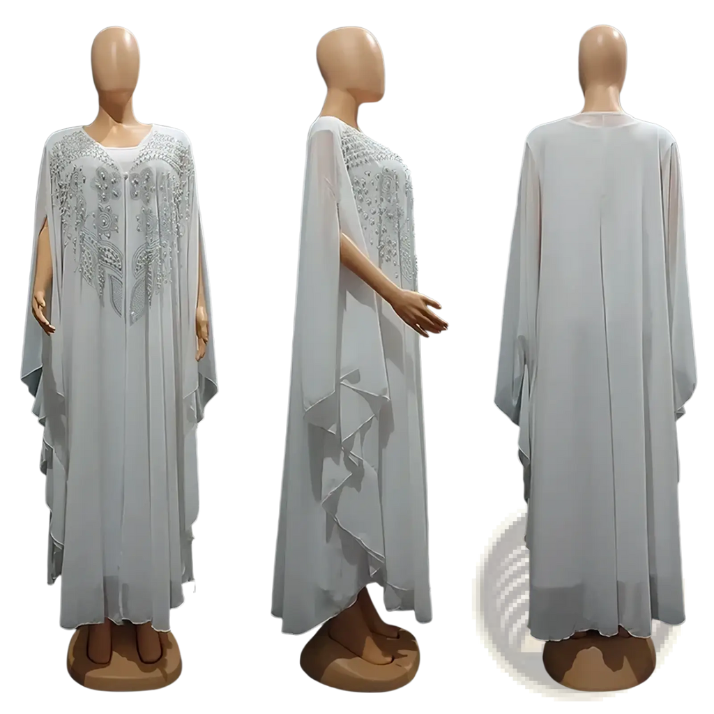 Plus size African party abaya set featuring a white sheer cape dress with intricate silver beading and layered ruffles