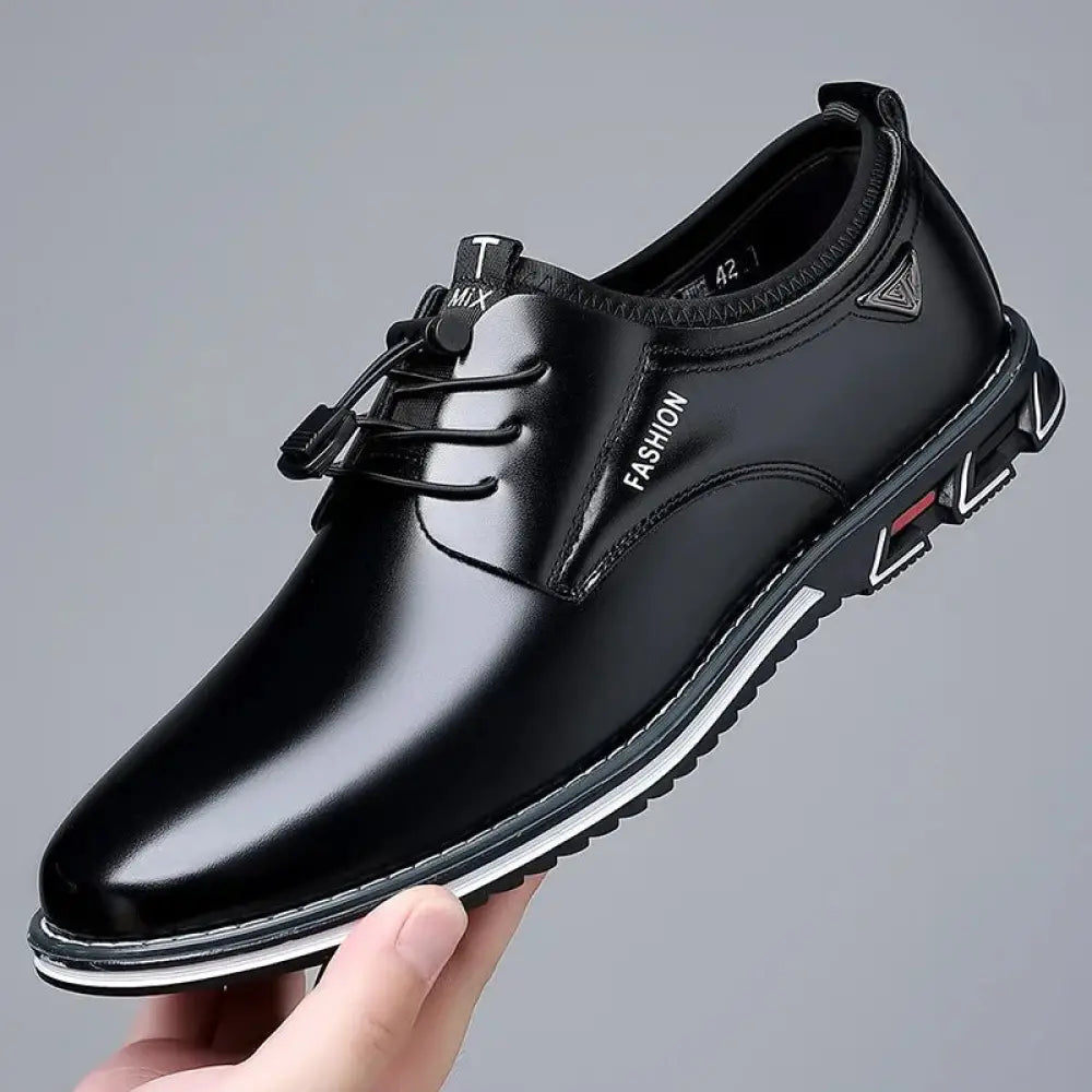 Men’s plus size black patent leather lace up casual shoe with white rubber sole and red heel accent back view