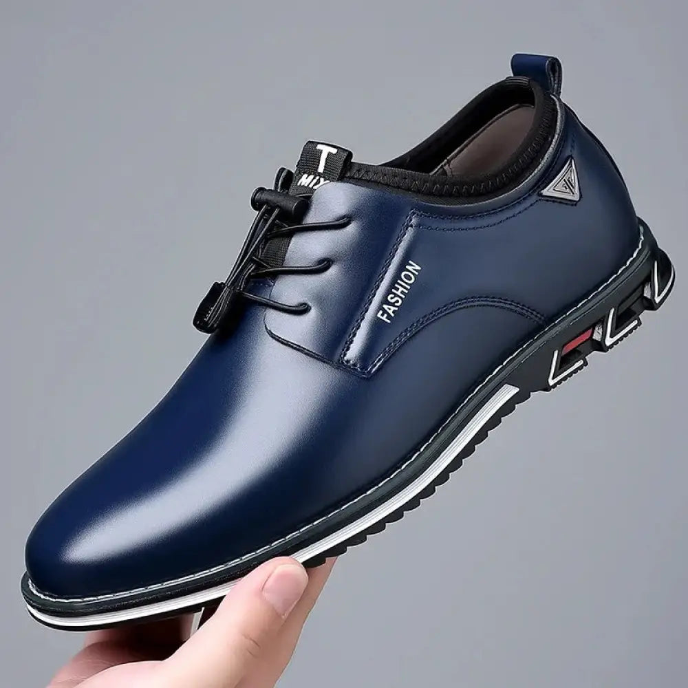 Men’s plus size dark blue leather lace up casual shoe with white rubber sole and fashion branding on the side