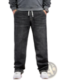 Plus size dark gray relaxed fit denim jeans with white elastic drawstring waistband and loose straight legs