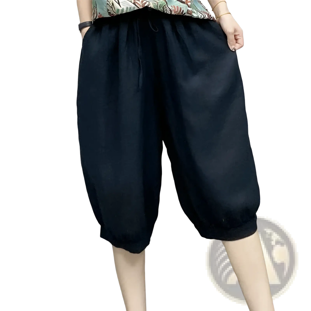 Plus size black linen harem capri pants with loose fit drawstring waist and elastic cuffs