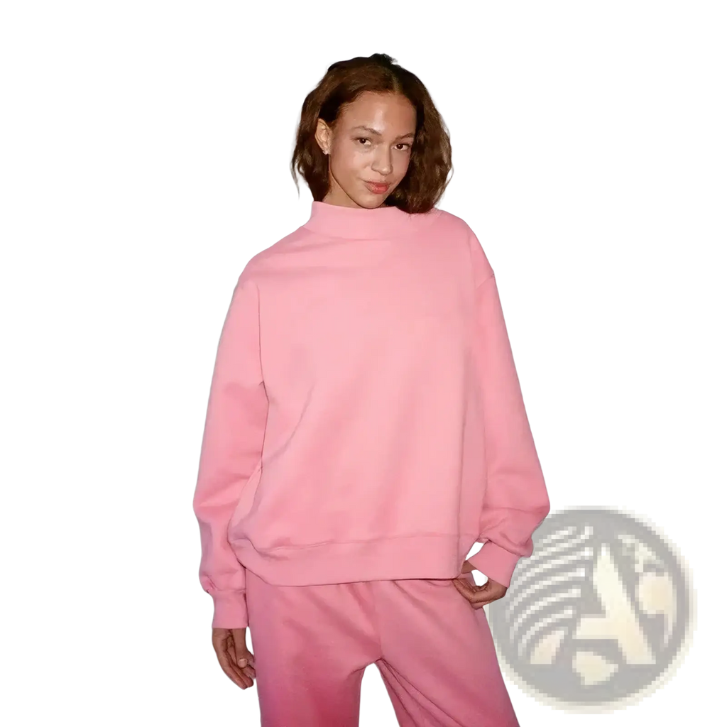 Plus size soft pink oversized crewneck sweatshirt with relaxed fit and ribbed cuffs ideal for casual wear