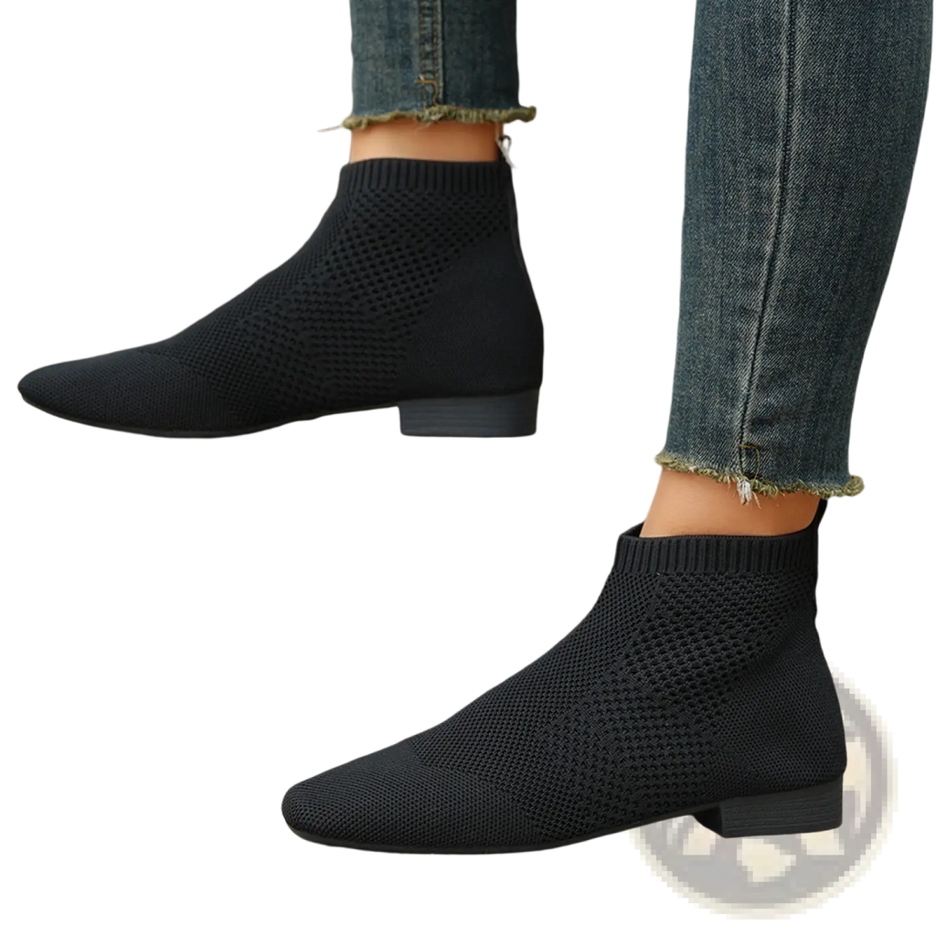 Plus size pointed toe black knit ankle boots with a low block heel and sleek stretchy design