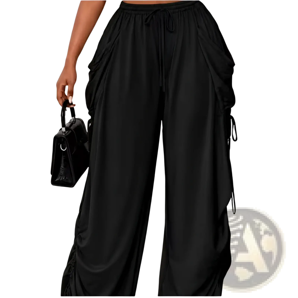 Plus size ruched athletic pants in black with wide legs and side pockets made from comfortable fabric