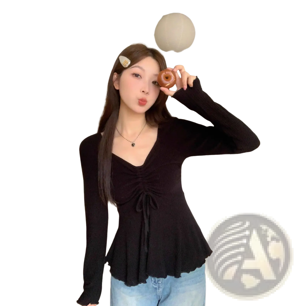 Plus size black ribbed long sleeve top with ruched front and peplum hem suitable for summer wear
