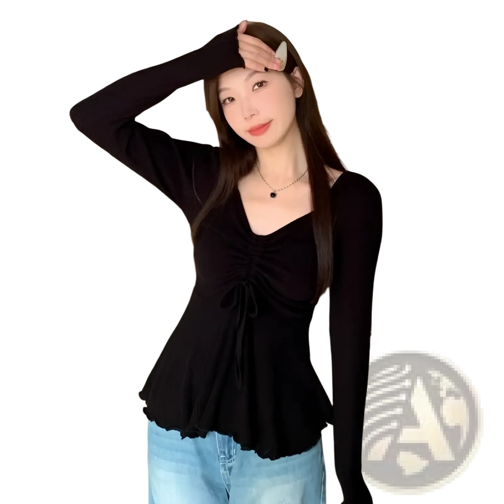 Black ribbed long sleeve top with ruched front and peplum hem designed for plus size summer wear