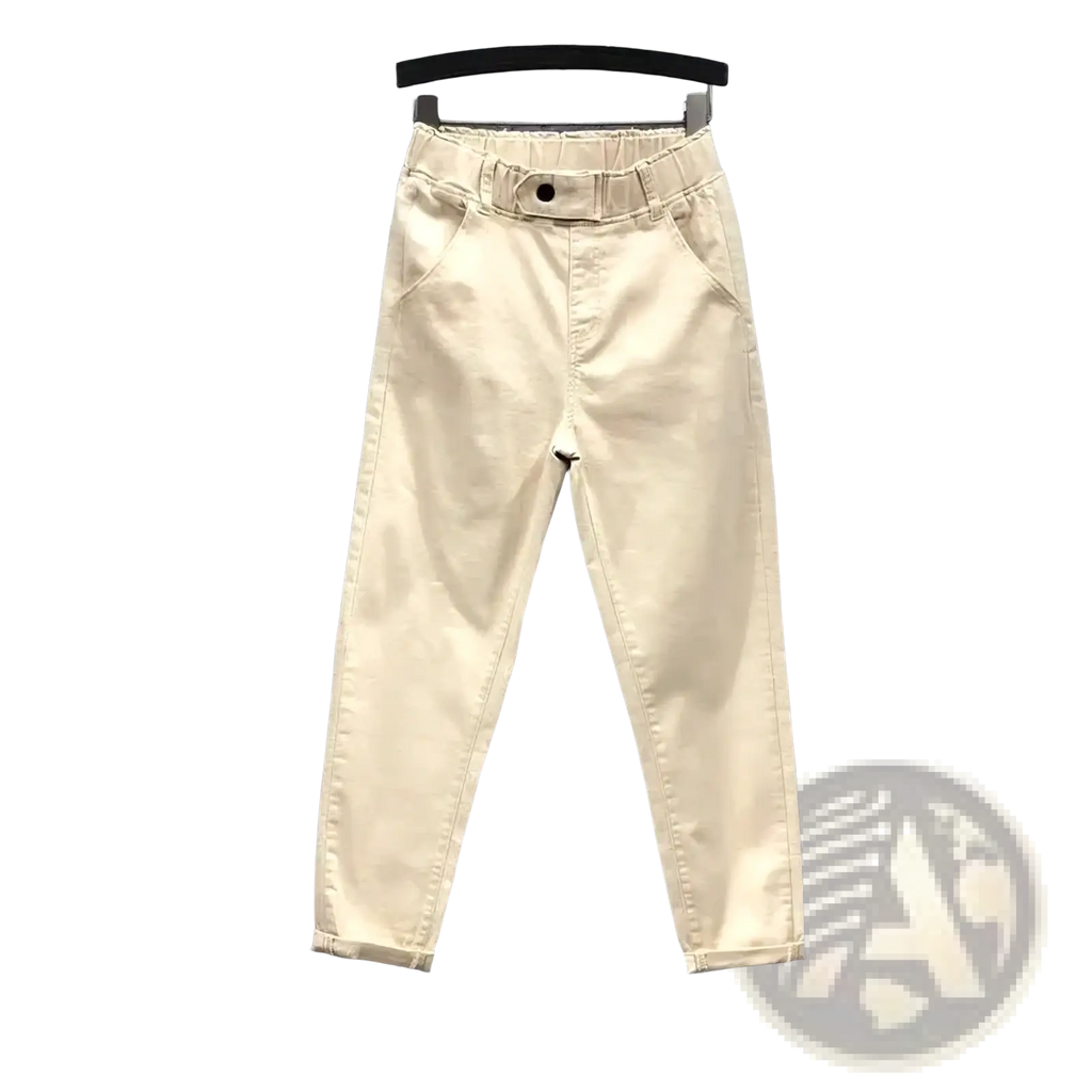 Beige plus size harem pants with high waist elastic waistband and single button closure in white denim material