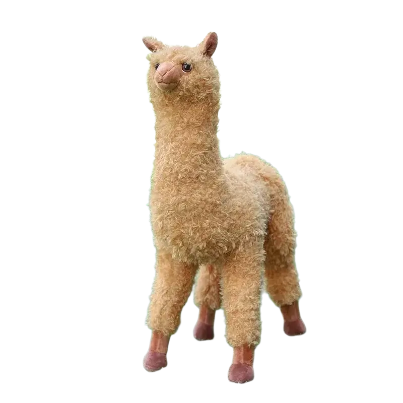 A plush alpaca stuffed animal toy modname=ckeditor with light brown soft curly fur and pink feet on green artificial grass
