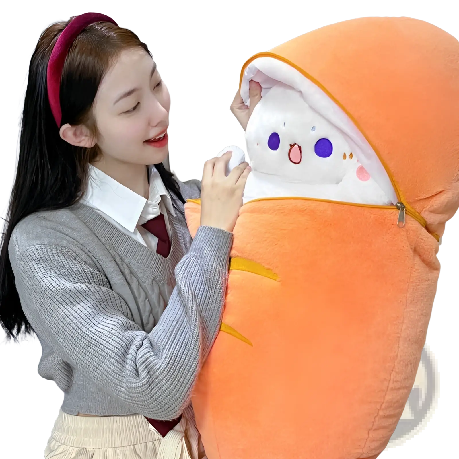 Plush animal pillow shaped like an orange carrot with a white face purple eyes and pink cheeks for rabbit and cat toy