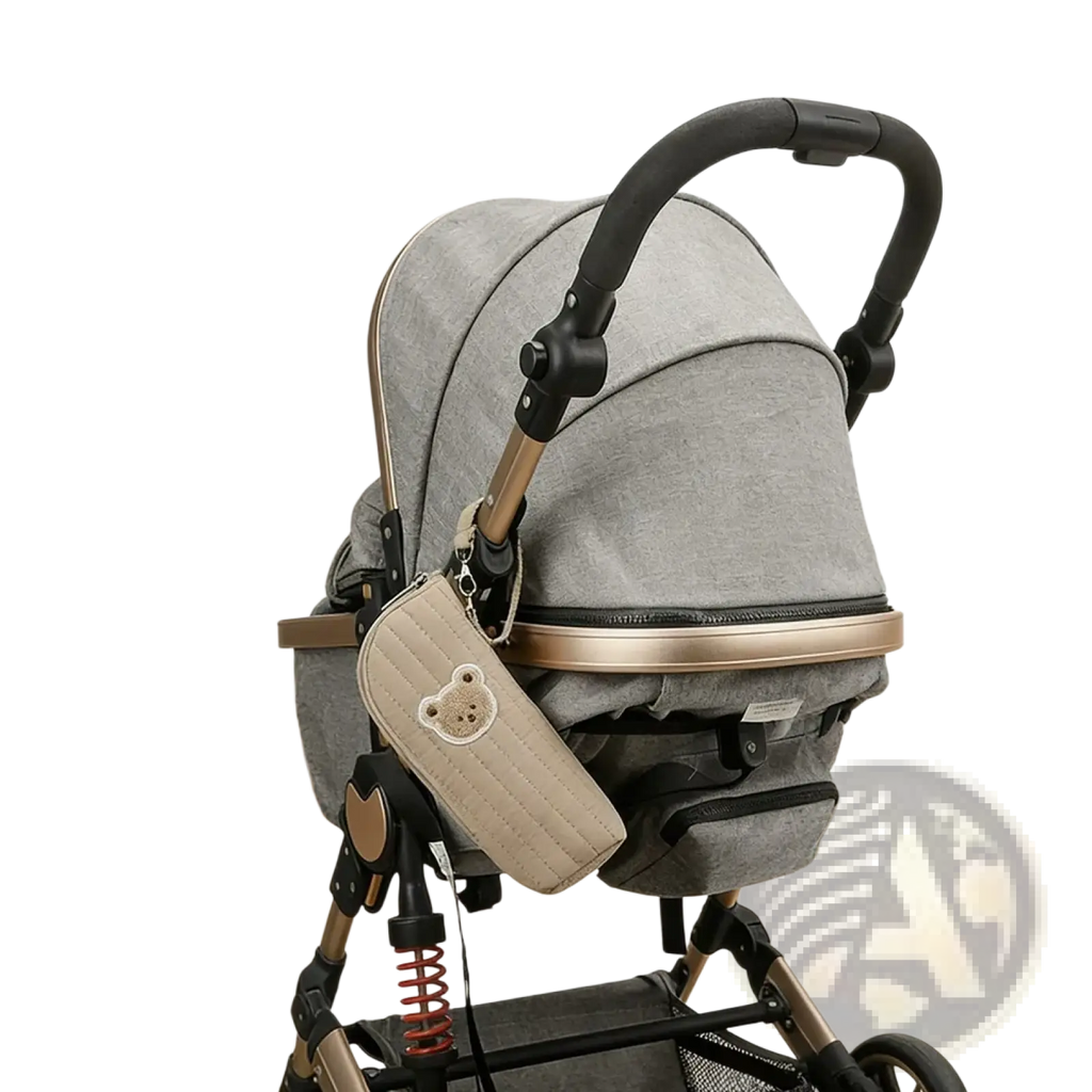 Gray fabric stroller with black and gold accents featuring quilted beige pouch for plush bear baby bottle warmer bag
