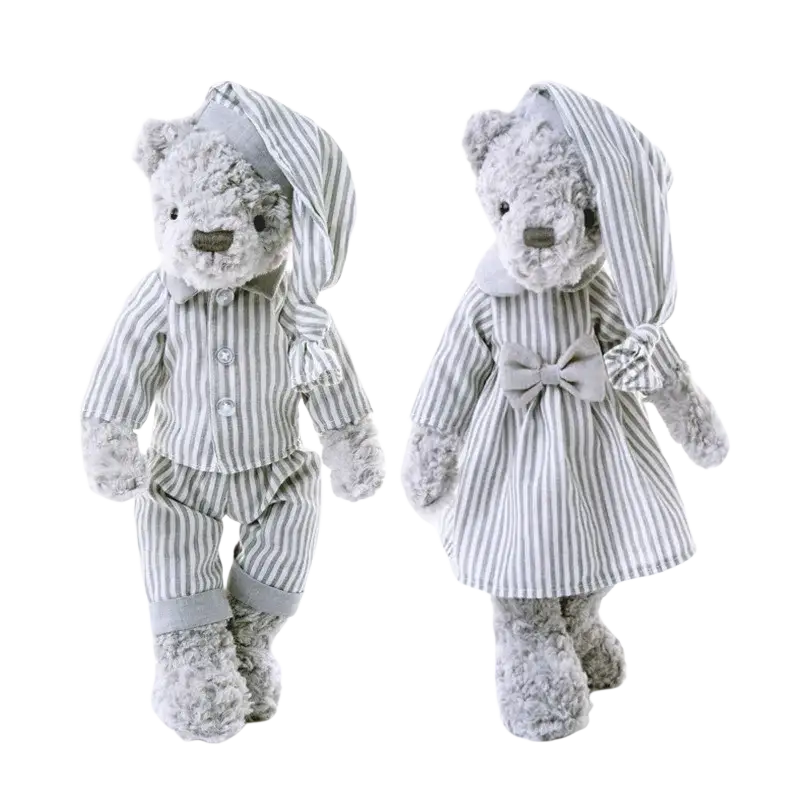 Two plush bear stuffed animals in gray and white striped pajamas with a bow tie and hooded nightcap sleeping toys