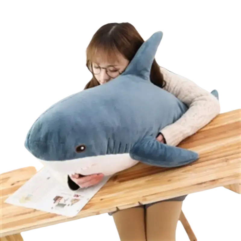 A plush blue and white shark stuffed animal pillow with a soft cuddly texture for comfort and decoration