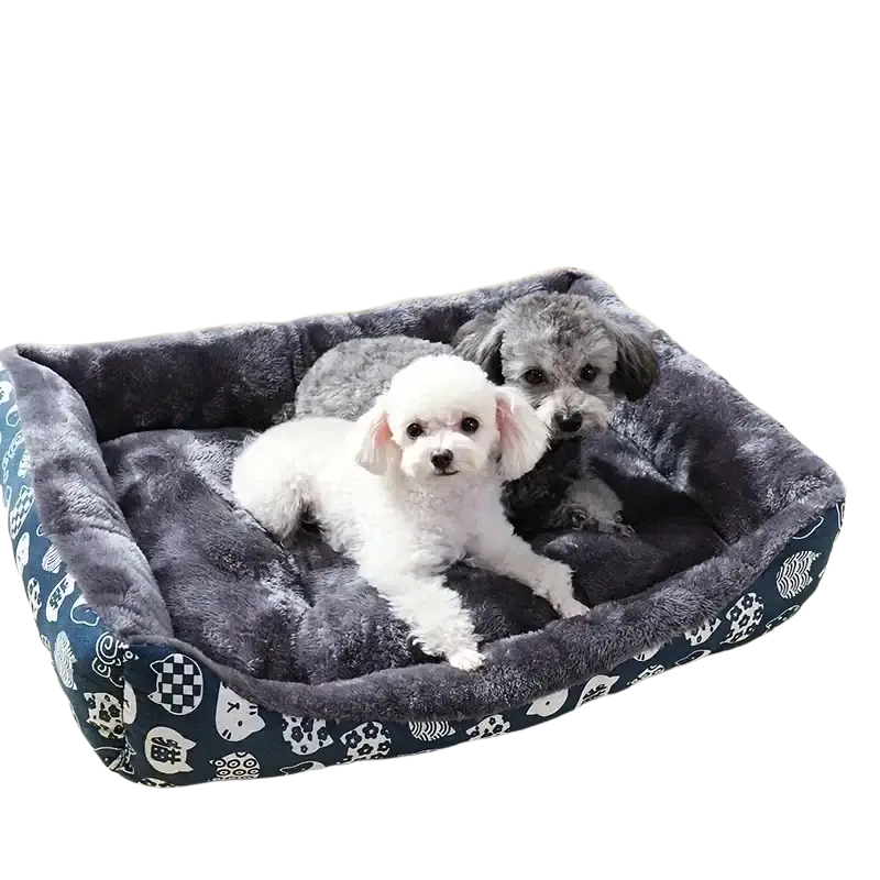 A cozy rectangular dog bed with plush gray interior and black and white cat pattern fabric for winter pet products
