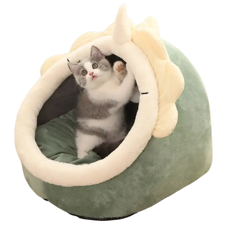 Plush cat cave bed in soft green and cream shaped like a unicorn made of washable plush fabric for cozy pet sleeping