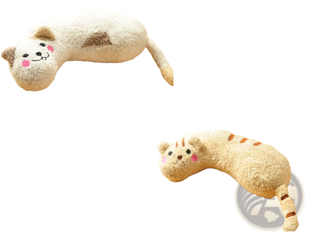 Plush cat pillow for neck support and joint relief in white and beige with pink cheeks and embroidered facial features