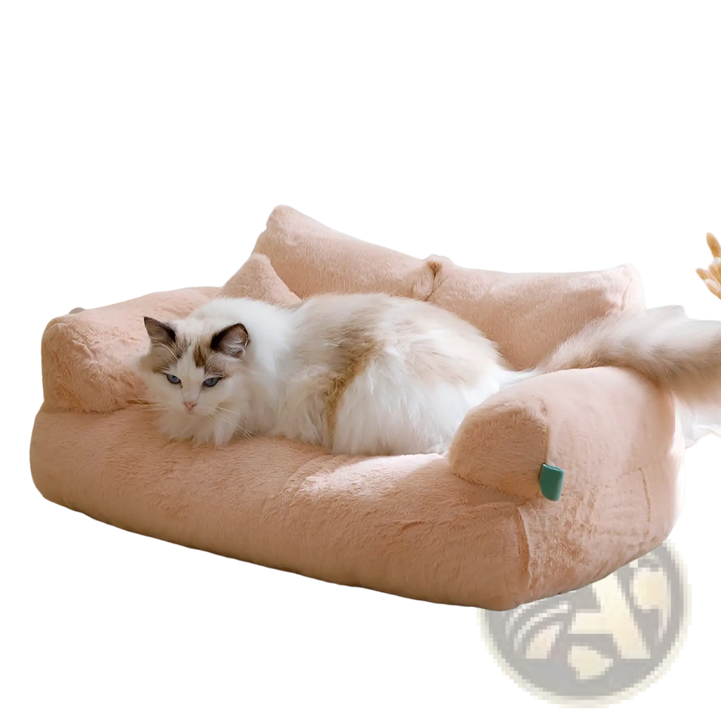 Soft peach-colored plush cat sofa bed with cushioned armrests and cozy upholstered design for warm winter lounging