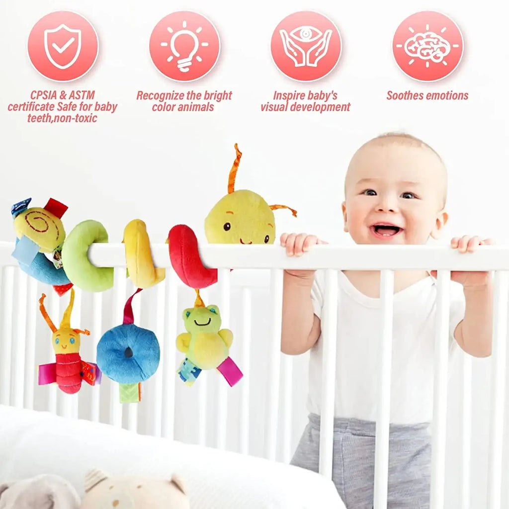 Colorful plush caterpillar baby car seat toy with soft bright fabric and friendly cartoon faces hanging from a white crib rail