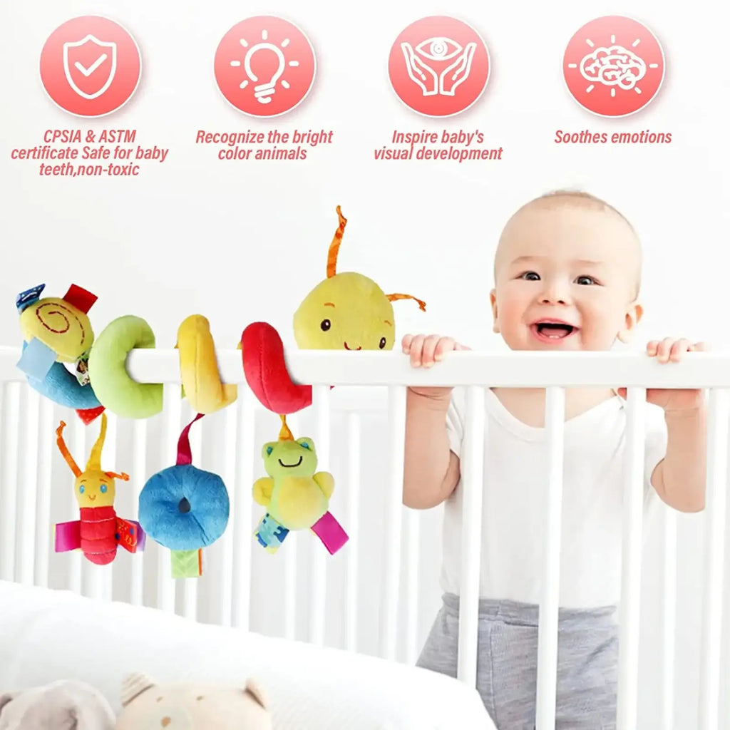 Colorful plush caterpillar baby car seat toy with soft bright fabric and friendly cartoon faces hanging from a white crib rail