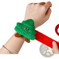 Plush christmas slap bracelet for kids featuring a green tree-shaped plush figure with pink eyes and red elastic strap