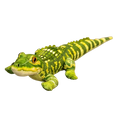 Plush crocodile stuffed animal toy in green and yellow with detailed scales and orange eyes resting on a magazine