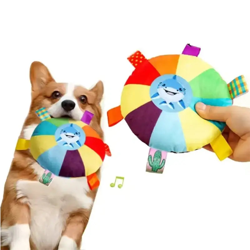 Colorful plush dog ball toy with a smiling shark face and rainbow grab tabs for playful furry children