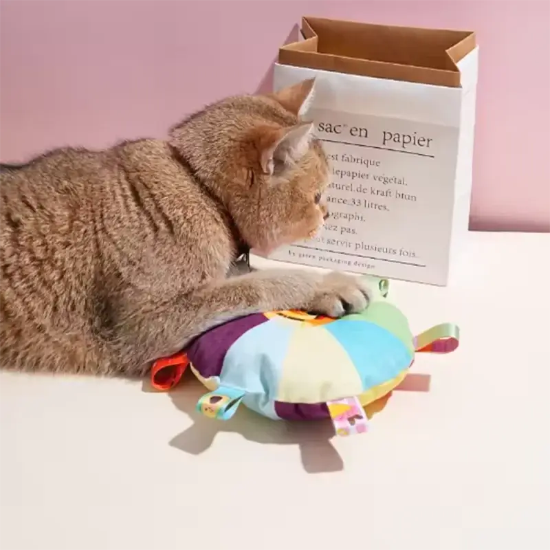 Plush dog ball toy shaped like a colorful patchwork turtle with grab tabs for furry children in pastel shades