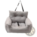 Gray plush dog car seat with black straps and metal buckle designed as a pet travel bed for secure transport