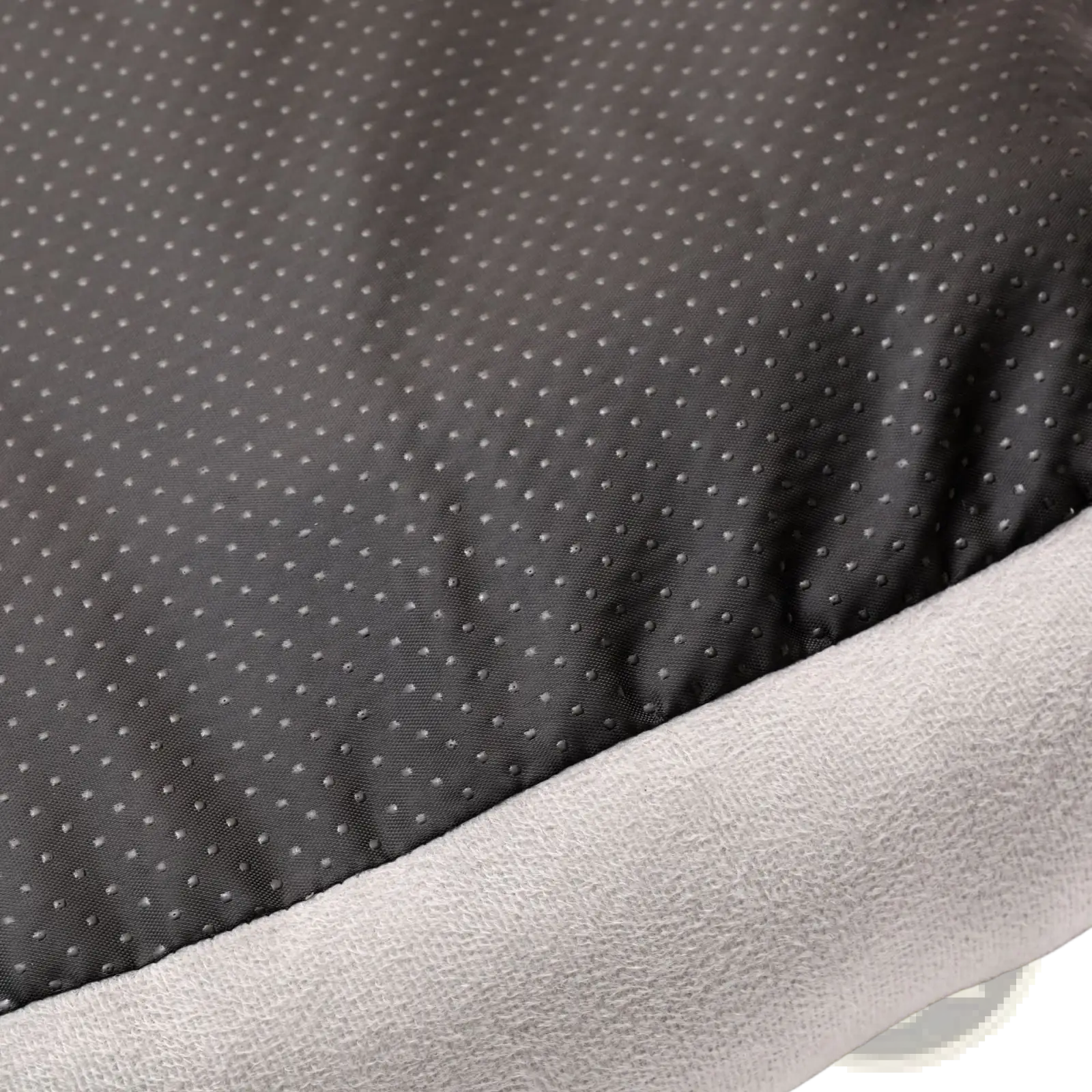 Black fabric with subtle dotted texture layered over soft gray fleece in plush dog car seat gray pet travel bed