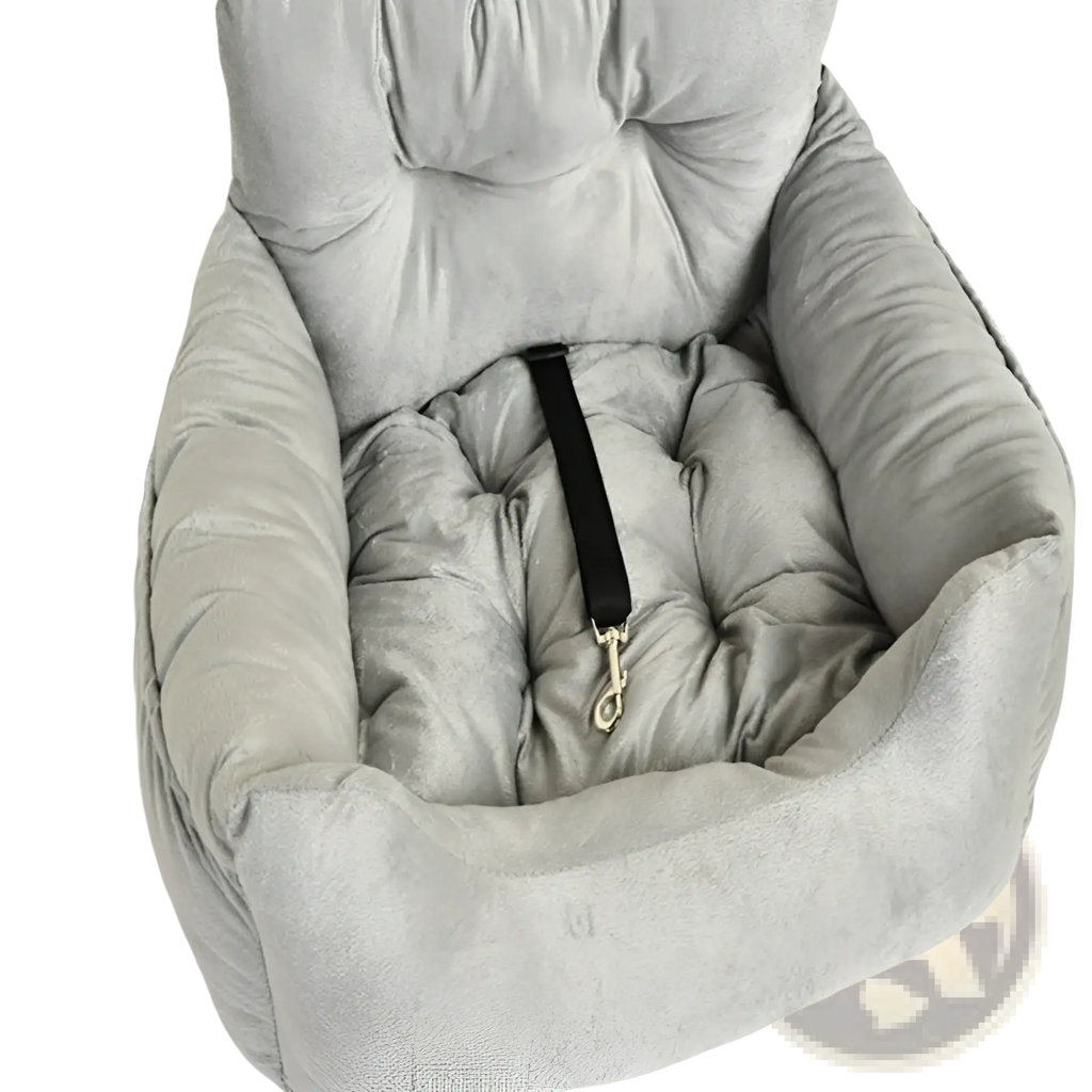 Gray plush dog car seat with tufted design and black safety strap for secure pet travel comfort