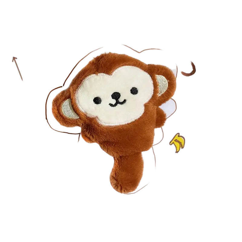 A plush brown and cream monkey-shaped interactive dog toy with embroidered facial features and squeaker inside