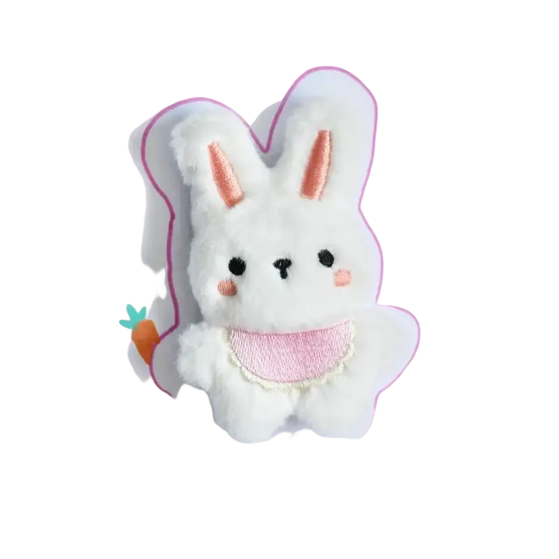 A soft white plush bunny toy with peach ears and cheeks wearing a pink lace-trimmed bib interactive squeaker toy type