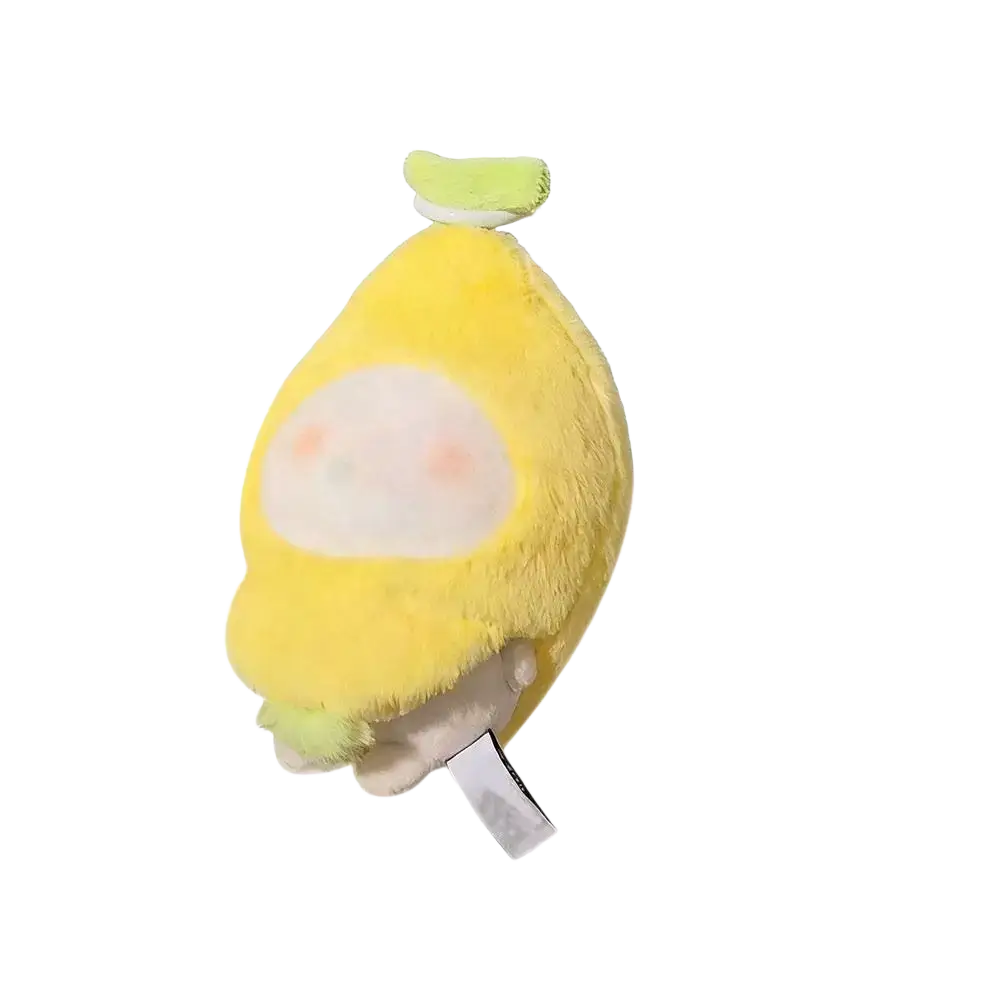 A soft yellow plush doll headgear shaped like a lemon with a white face and light green stem 10cm tall