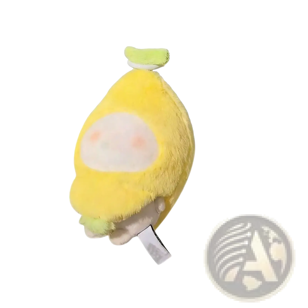 A soft yellow plush doll headgear shaped like a lemon with a white face and light green stem 10cm tall
