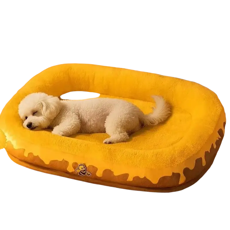 Plush donut dog bed in yellow honey with soft texture and small bee emblem ideal for comfortable pet resting