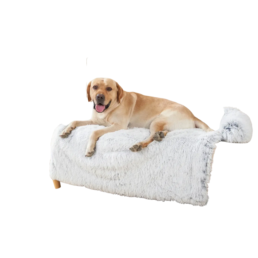 A plush light gray faux fur dog bed sofa with soft shaggy texture and fluffy pom-pom ends for warmth and comfort