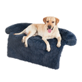 A plush navy blue faux fur dog bed sofa with soft shaggy texture and rounded armrests for a warm washable nest