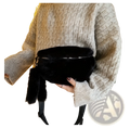 Black plush faux fur fanny pack with zipper closure and matching tassel for crossbody and messenger use