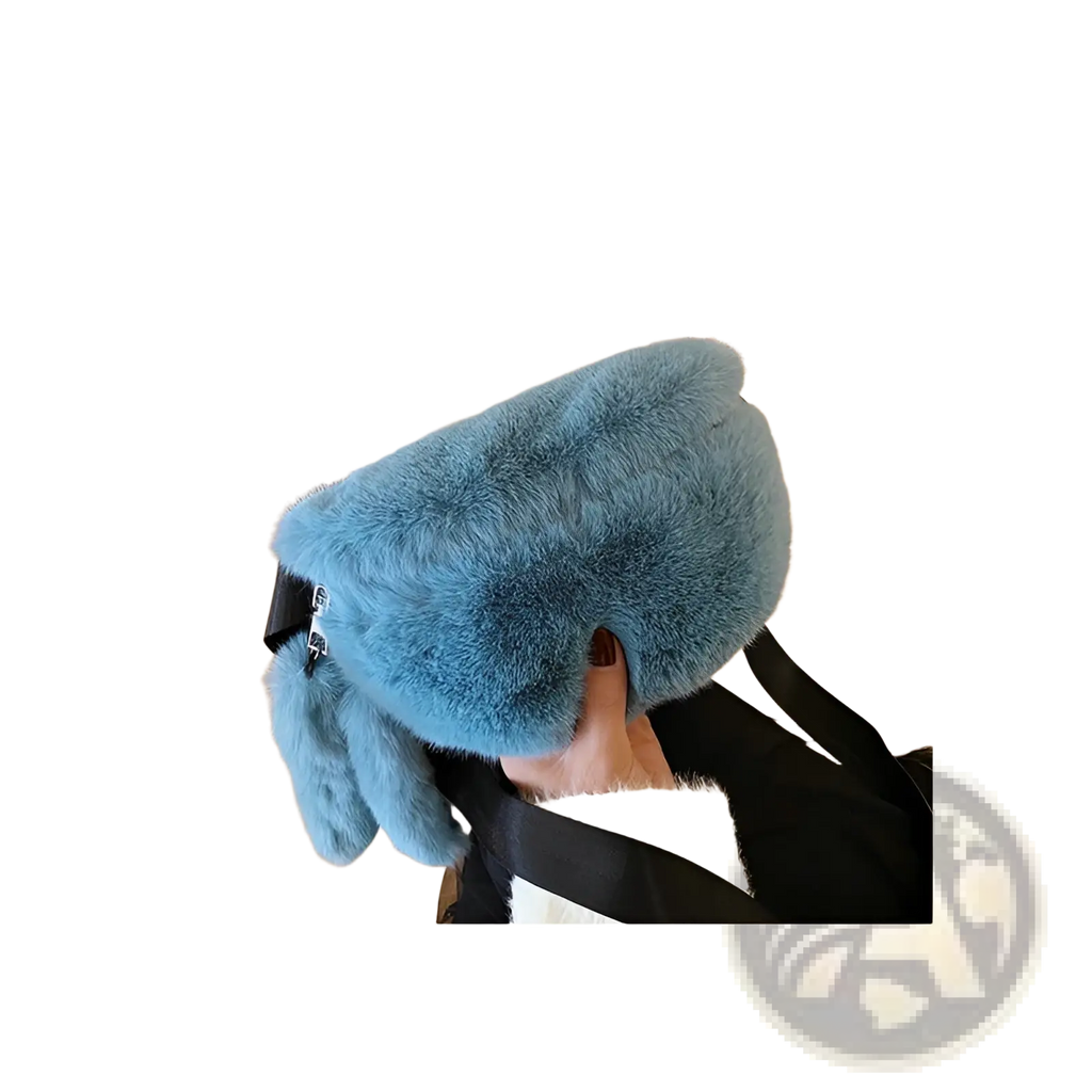 A soft light blue plush faux fur crossbody bag with black strap and zipper closure for hands-free use