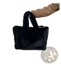 Black plush faux fur tote bag with soft texture and sturdy handles featuring a chain strap shoulder design