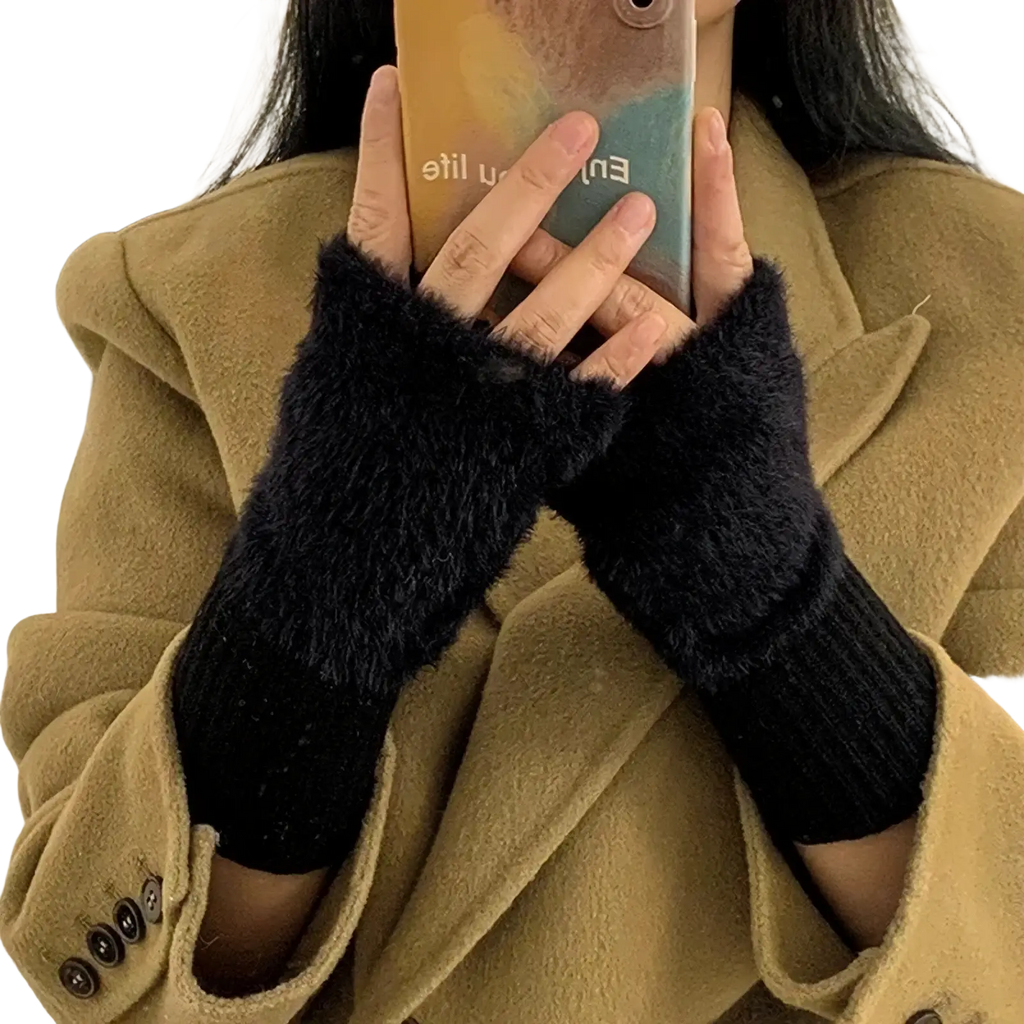 Black plush fingerless gloves with fuzzy texture and ribbed knit cuff for warm winter wrist protection