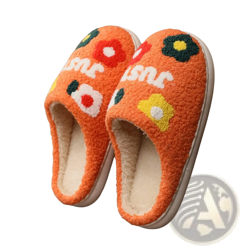 Orange plush floral cotton slippers with soft tpr sole featuring colorful embroidered flowers and white sne lettering