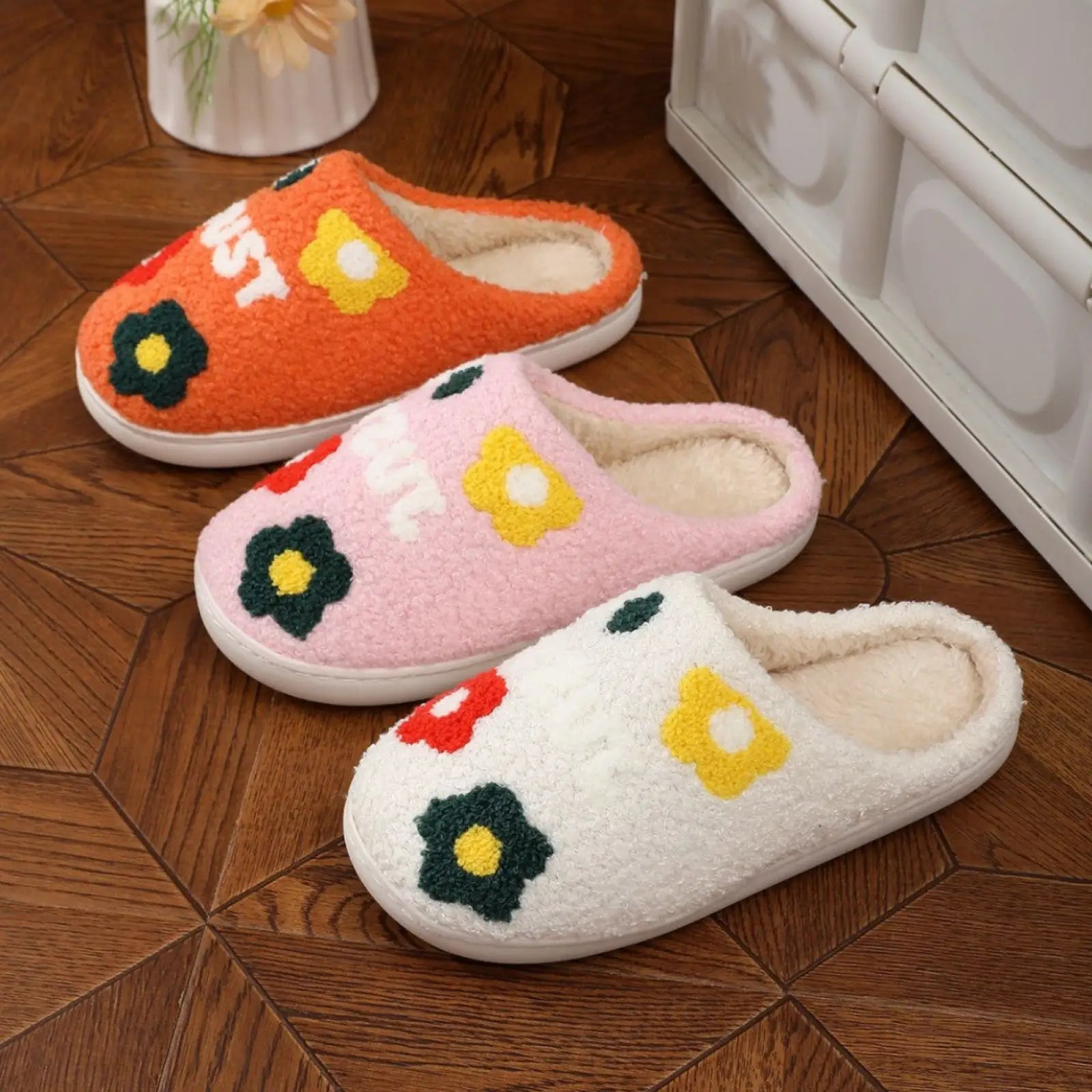 Three cozy plush floral cotton slippers in orange pink and white with soft TPR sole and colorful embroidered flowers